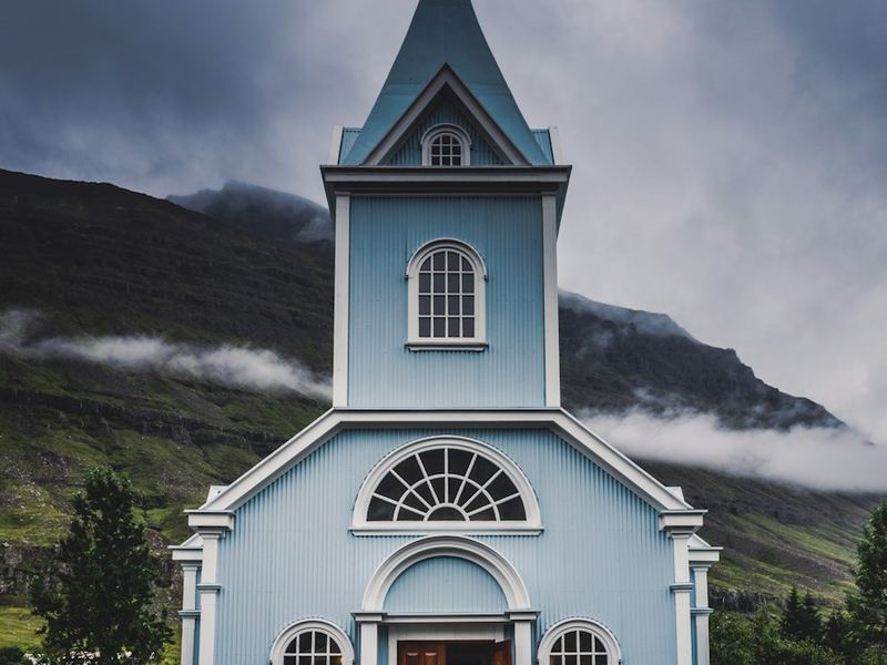 Blue church with steeple