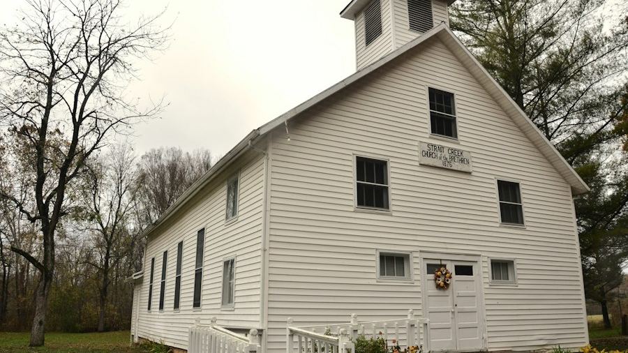 White wooden church on a lawn
